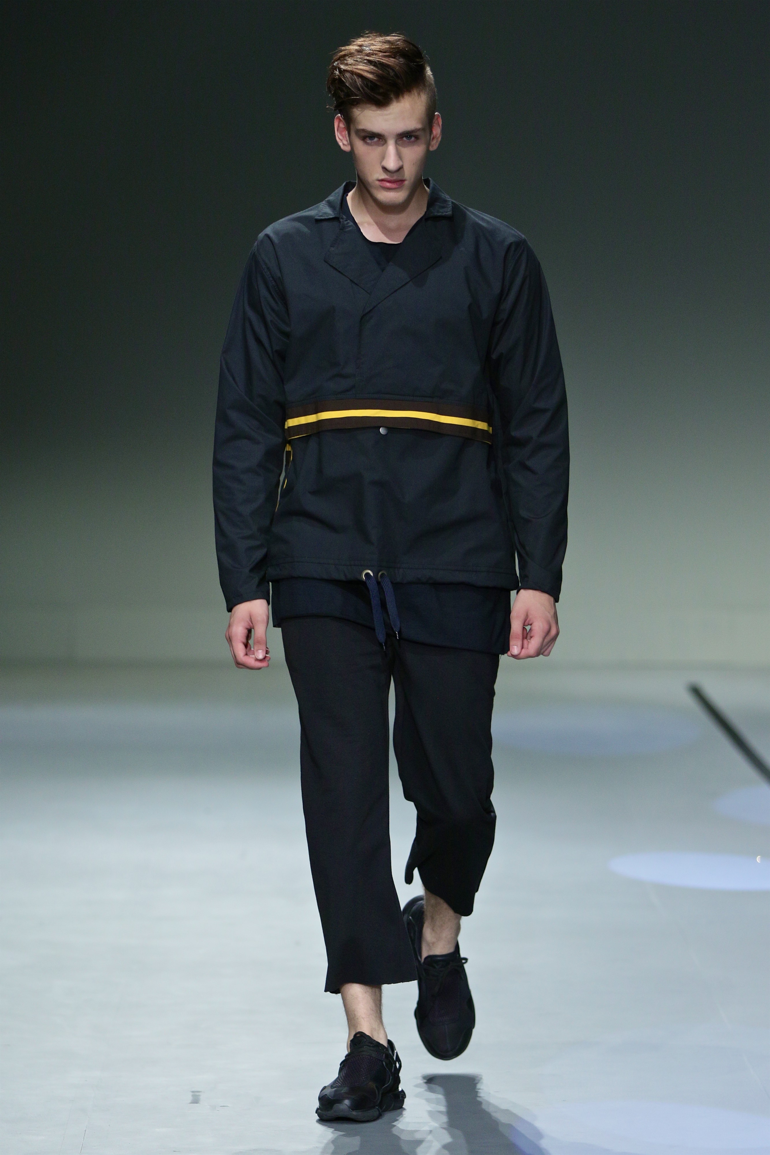 SA Fashion Week runway black outfit with yellow band detail